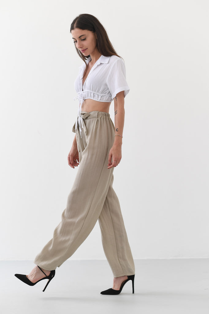 Pantalone a palazzo beige a vita alta - Tabloit.it