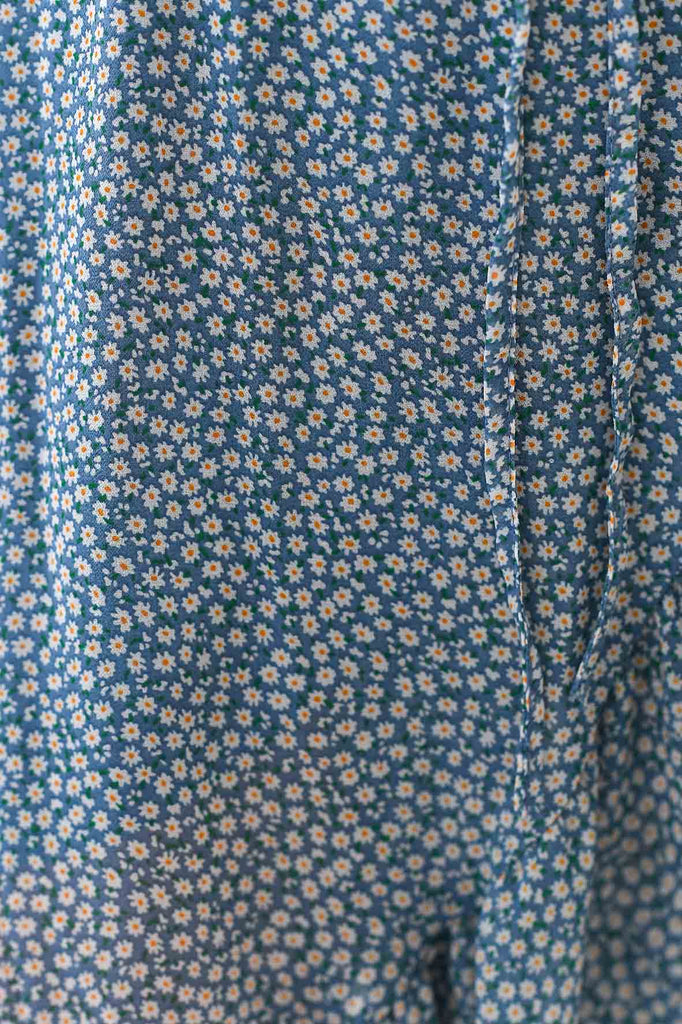 Vestito a portafoglio con volant  e stampa a fiori celeste - Tabloit.it